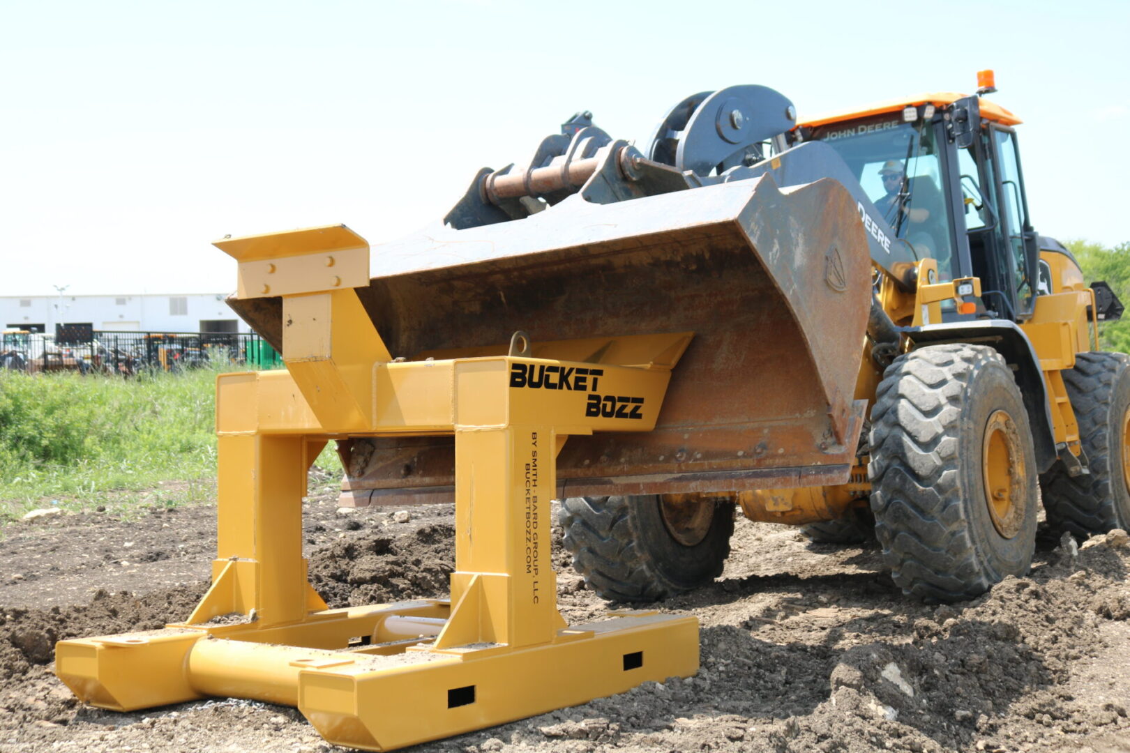 Large Loader using the Bucket Bozz Hard Mount Bucket Cleaning Tool